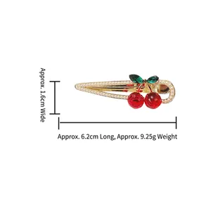 Sparkling rhinestone cherry hair clip with faux pearls and gold dripping metal finish
