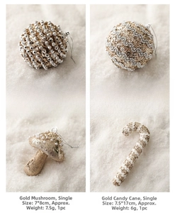 Detail of golden Christmas ornaments including beaded spheres and candy cane shapes