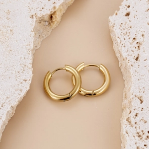 Polished chunky gold hoop earrings in stainless steel with a minimalist hinged design
