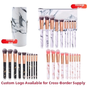 Detail view of marble pattern makeup brush sets with matching storage barrel and pouch