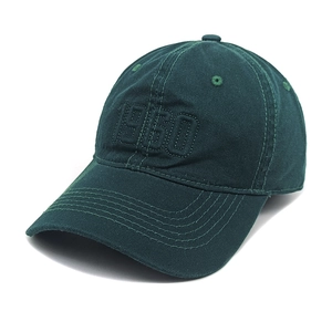 Close-up of deep green cotton baseball cap featuring detailed 1960 numeric embroidery