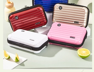 Mini suitcase shaped crossbody bags in glossy colors with Forever Young logo detail
