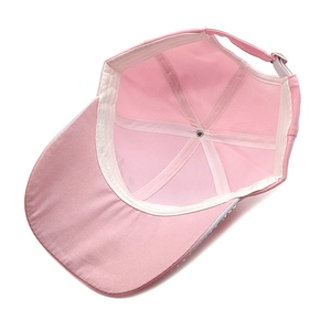 Detail view of pink cotton baseball cap interior with rhinestones and metal buckle