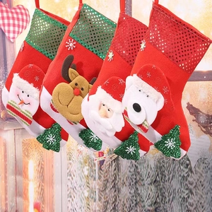 Set of four Christmas stockings with sequins, Santa, reindeer, and snowman plush figures
