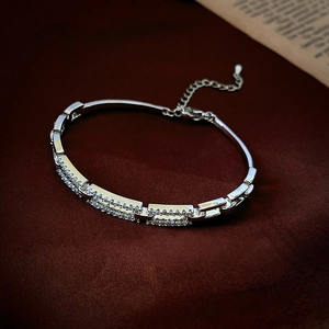 Detail of silver chain bracelet with pavé-set zircons and adjustable lobster clasp