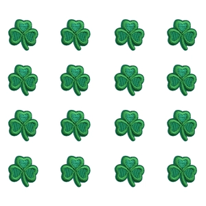 Detailed macro view of 16 green clover embroidery patches with high-density stitching