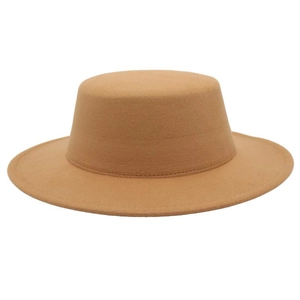 Close-up of the stitching and wool felt texture on a khaki flat top boater hat