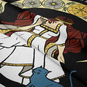 Macro shot of bohemian tapestry fabric showing intricate tarot style print and texture