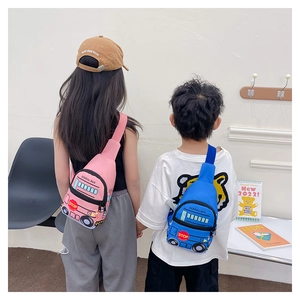 Kids school bus cartoon chest bag with adjustable straps shown on a child back