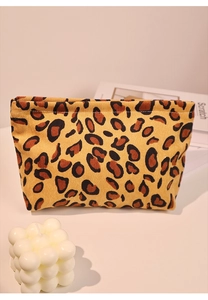 Detail of leopard print corduroy makeup bag with soft velvet texture and trendy pattern