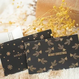 Elegant black and gold Merry Christmas card envelope set with pine needle patterns