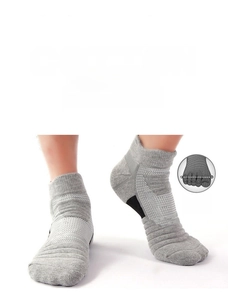 Detail of grey athletic socks featuring breathable mesh and cushioned shock-absorbing sole