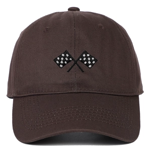 Close-up of embroidered black and white checkered flags on a brown twill cotton baseball cap