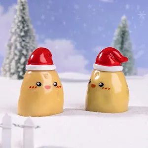 Mini Christmas potato figurines with red hats in snow scene DIY micro landscape ornaments