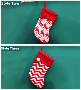 Close-up of knit Christmas stockings with reindeer patterns and festive pom-poms