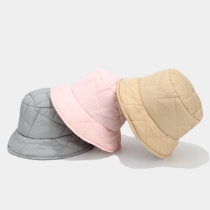 Quilted warm bucket hats in grey, pink, and beige with stylish diamond lattice pattern