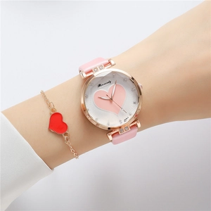 Detail shot of women's pink leather watch with heart dial and matching heart bracelet