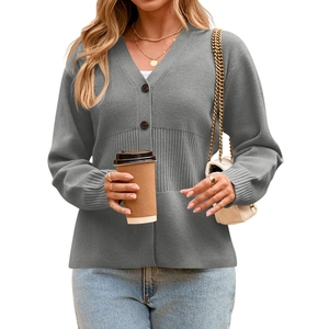 Detail of grey V-neck knit cardigan showing ribbed texture and button closure