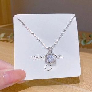 Elegant silver square pendant necklace with a round brilliant centerpiece on cross chain