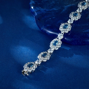 Elegant S925 silver bracelet featuring blue oval gemstones and sparkling white zircons