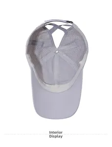 Detail of grey ponytail baseball cap showing breathable inner mesh and cross elastic bands