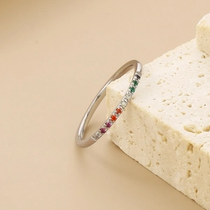 Detailed view of slim titanium steel ring featuring colorful rainbow zircon stones