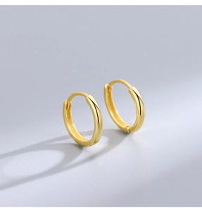 Detailed view of glossy gold-plated S925 sterling silver hoop earrings with a polished finish