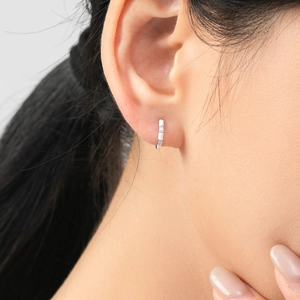 S925 sterling silver hoop earrings with white enamel and cubic zirconia on model