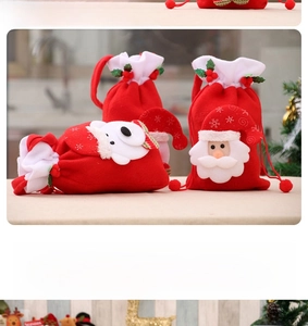 Detail of felt Christmas drawstring gift bags with 3D Santa and Snowman embroidery