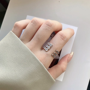 Close-up of S925 sterling silver multi-layer heart ring with clear zircon on model hand