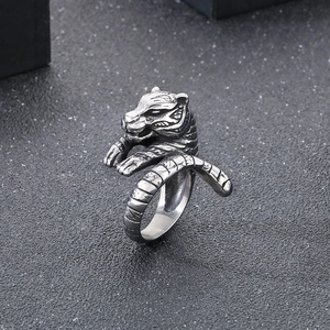 Macro shot of punk style tiger head ring showing detailed silver steel texture