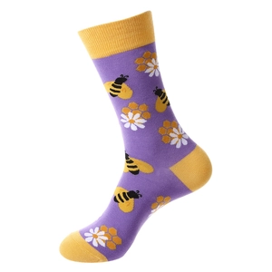 Purple cotton socks featuring bee, honeycomb, and daisy patterns with yellow accents