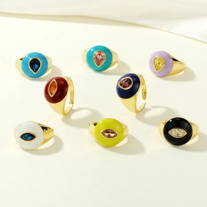 Detailed set of 8 gold wide band rings with colorful enamel and inset drop-shaped zircons