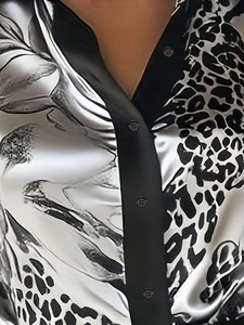 Detail shot of leopard print satin shirt featuring black contrast collar and button front