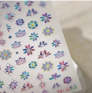 Macro shot of laser holographic floral nail stickers M-383 with blue and purple patterns