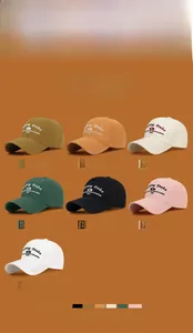 Detailed grid display showing seven colors of cotton baseball caps with embroidered text