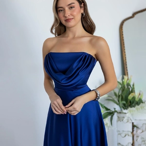 Detail of elegant navy blue satin evening dress featuring a pleated strapless neckline