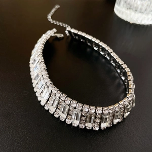 Macro shot of silver rectangular rhinestone choker necklace with sparkling fringe detail