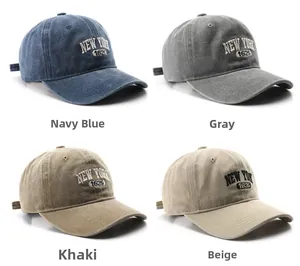 Detail of four washed cotton baseball caps in navy, grey, khaki and beige with embroidery