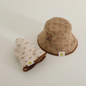 Kids corduroy bucket hats in brown and beige with bear prints and HAPPY embroidery