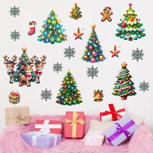 Christmas wall decals with deer and pine trees on a white wall above holiday gift boxes