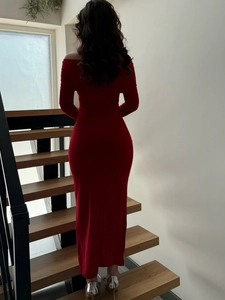 Detail of red off-shoulder long-sleeve slim fit dress showing back curve and material