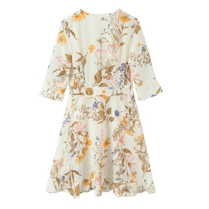Floral V-neck wrap dress in cream with yellow and blue flower patterns and ruffled hem