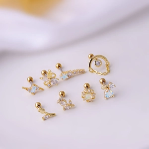 Set of 7 gold titanium steel ear studs with opal and crystal in various trendy shapes
