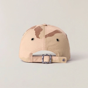 Detailed back view of desert camo baseball cap with vintage cross engraved buckle