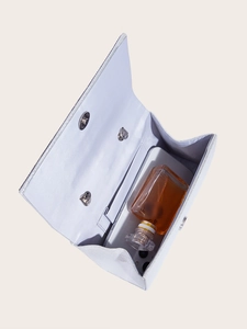 Internal view of silver evening bag showing storage space for phone and perfume