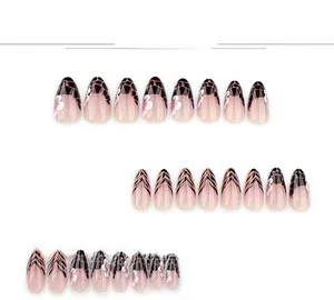 Detail of French stiletto fake nails with leopard zebra patterns and floral accents