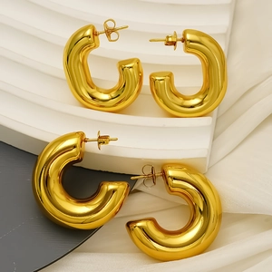 Elegant chunky gold-plated C-shape hollow hoop earrings in minimalist titanium steel style