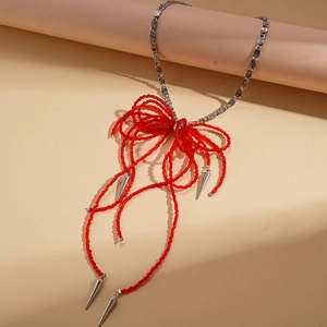 Fashionable red beaded bow necklace with silver tassels for a unique punk style design
