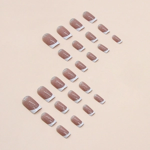 French tip press-on nails with silver glitter and nude pink base in medium square shape